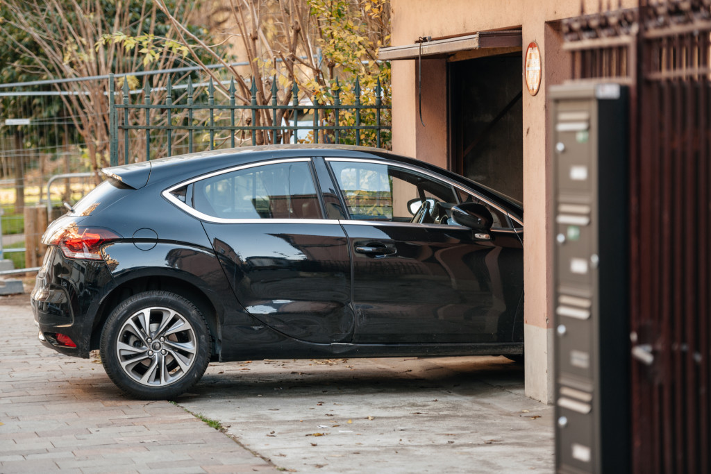 a car halfway inside a garage door