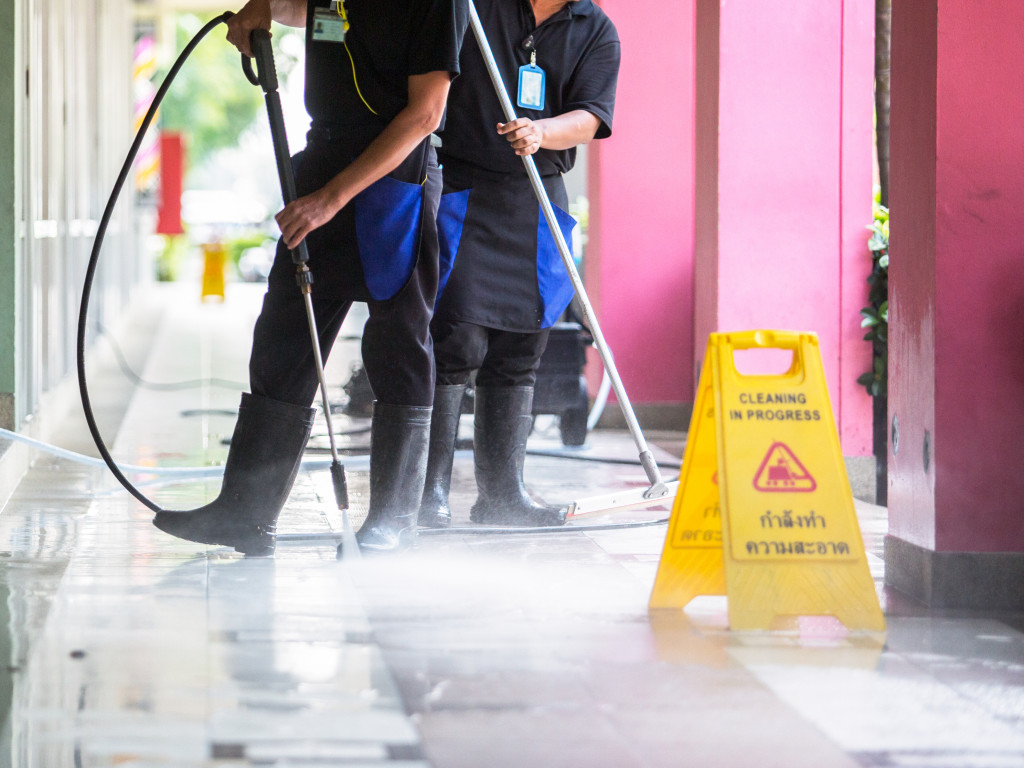 workers spraying coatings on the floor