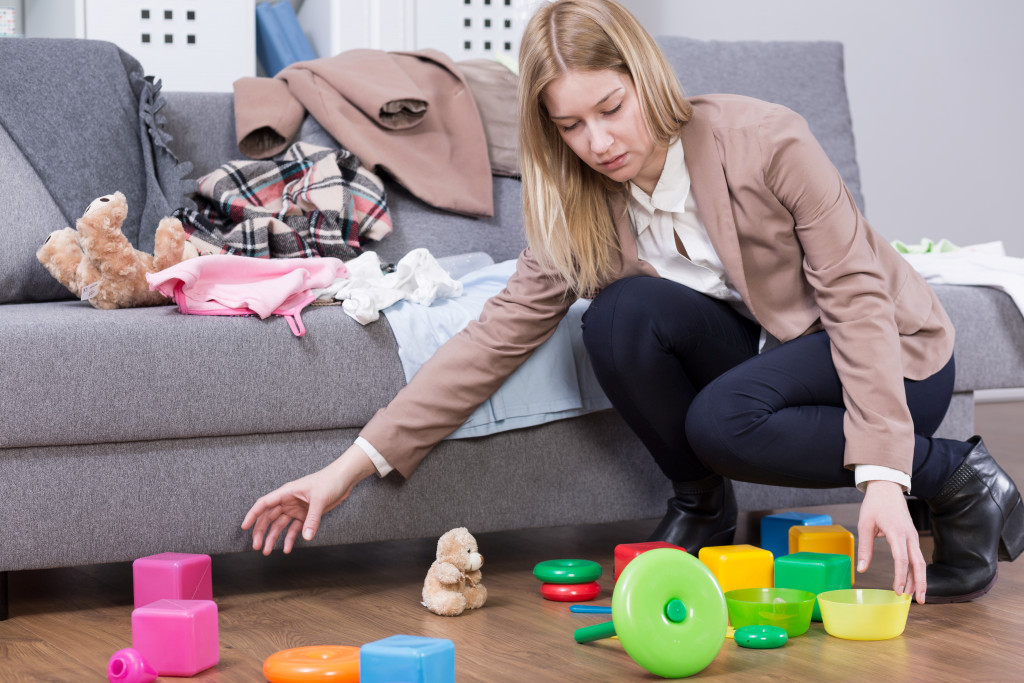 mom cleaning toys at home